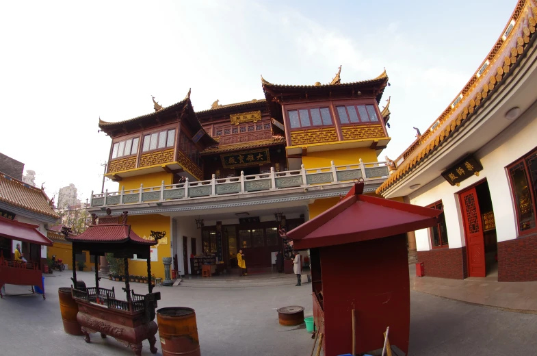 two buildings are shown near each other with benches