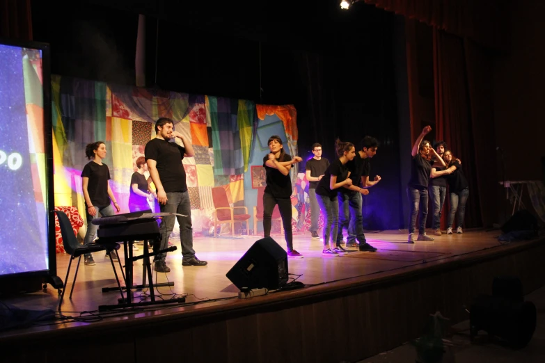 a group of people standing on top of a stage