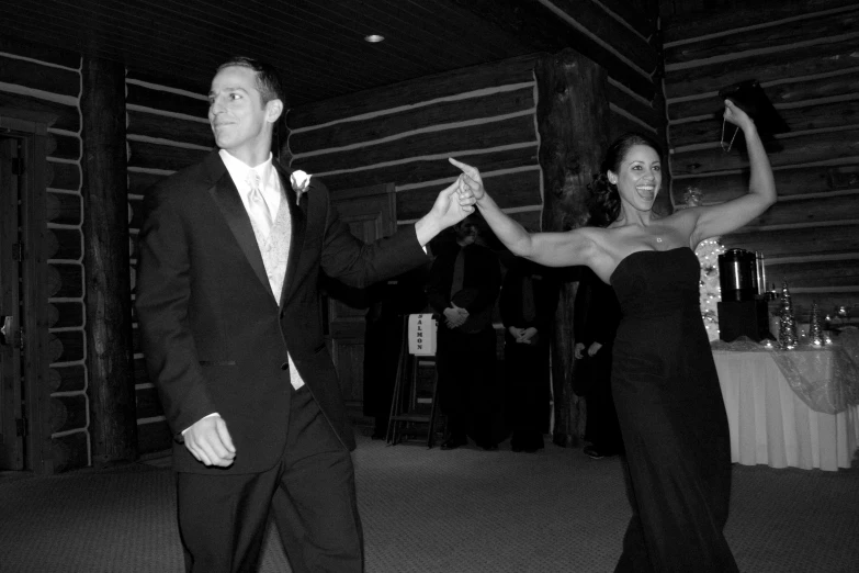 a man and woman doing a dance at an event