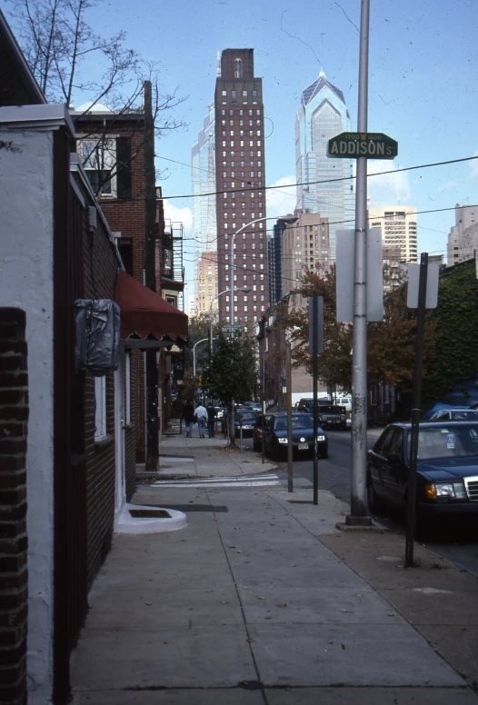 a brick building with a view of an alley in the distance