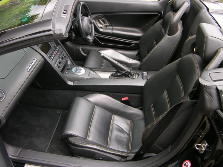 the interior of a black and grey sports car