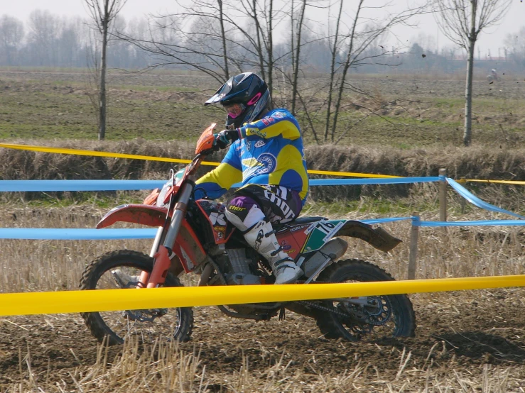 motorbike rider on an atv in the middle of a course