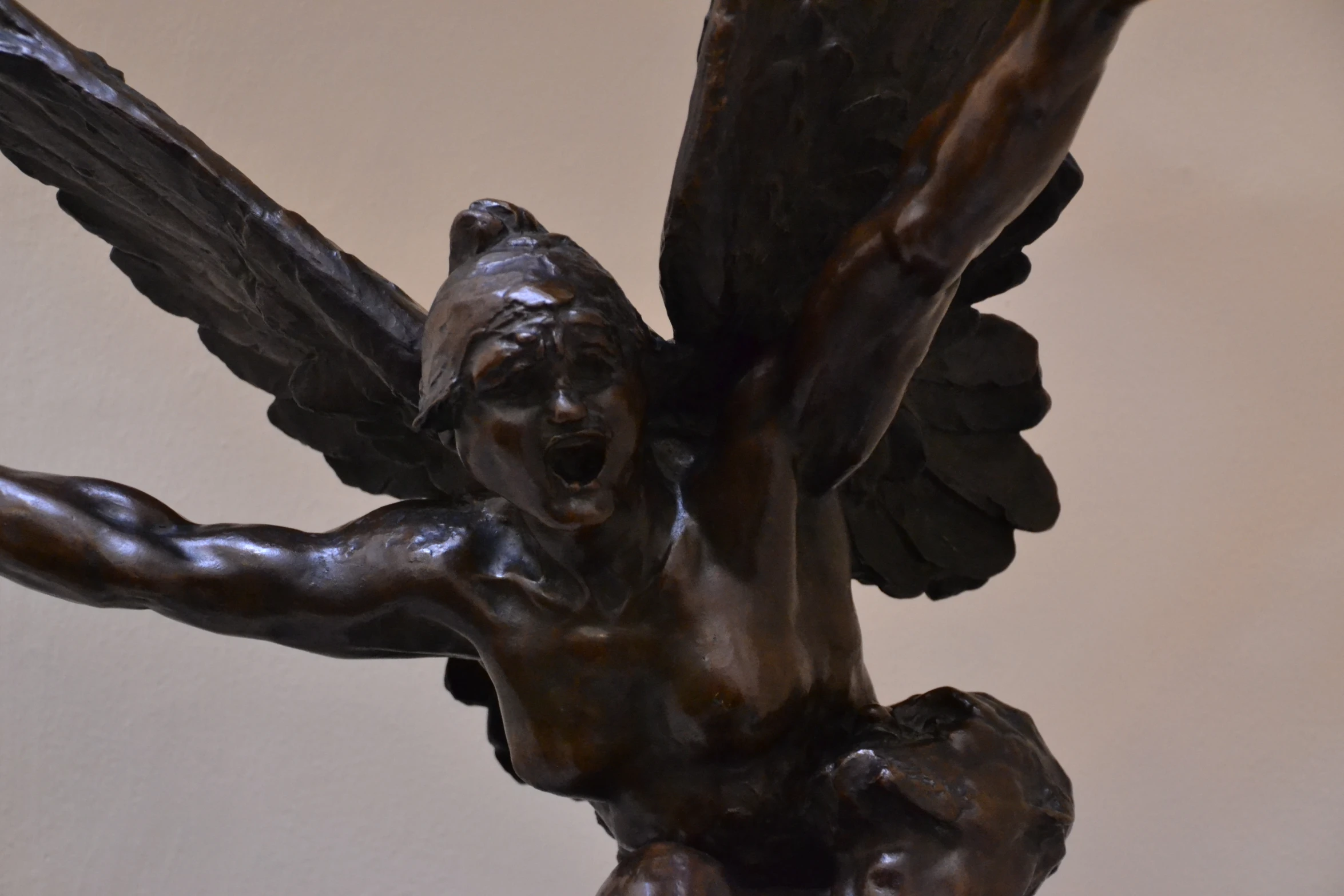 an artistic bronze statue of an angel holding a baby