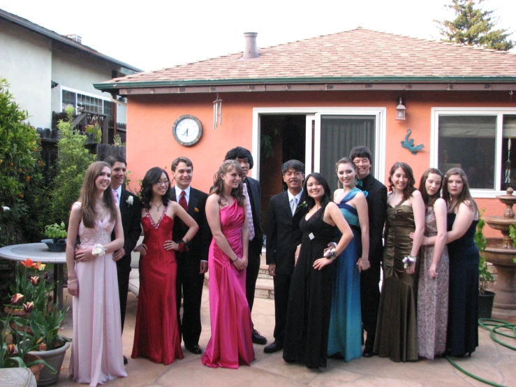 the seven people all are smiling in their dresses