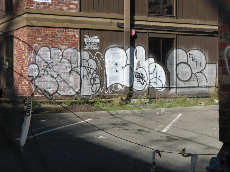 an old brick building with graffiti on it