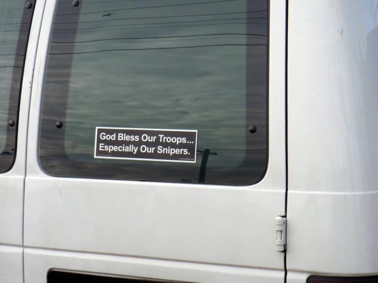 a white van parked on a dirt road