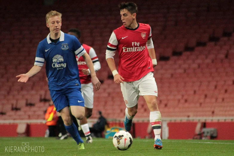 there are two male soccer players competing in the game