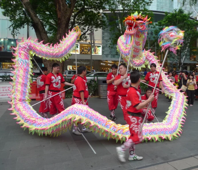 a dragon float is being displayed for the crowd