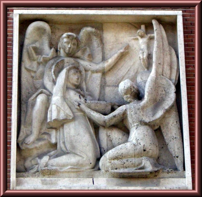 the artistic sculpture depicts two people with a child