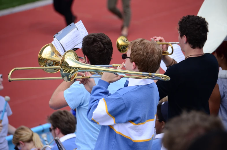 a group of children that are playing on musical instruments