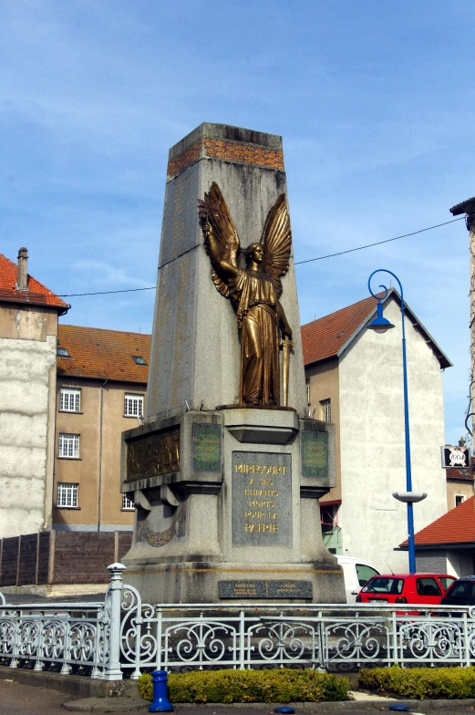 a statue on the corner of a street