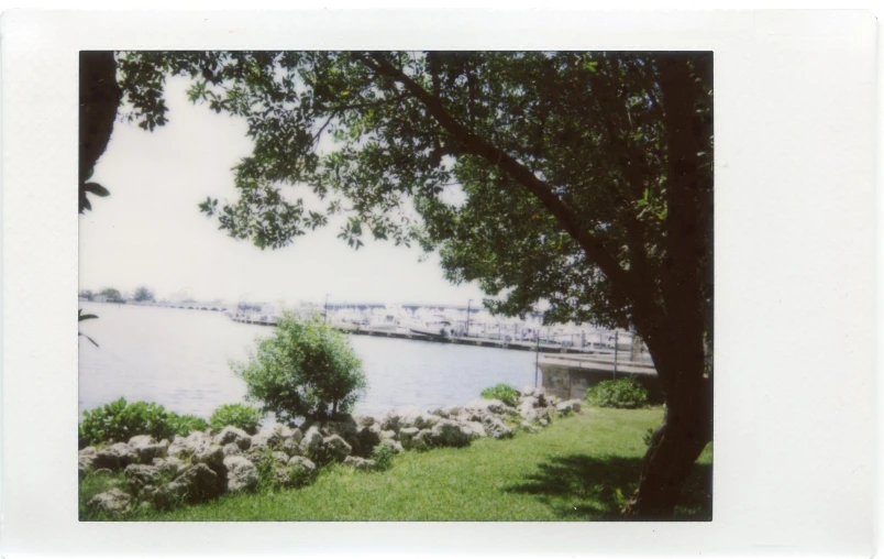 a river flows past a bridge over water