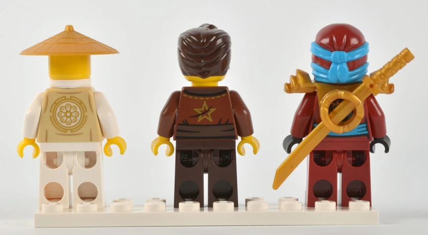 a lego figure set contains a ninja, a scorpion, and a red headed girl