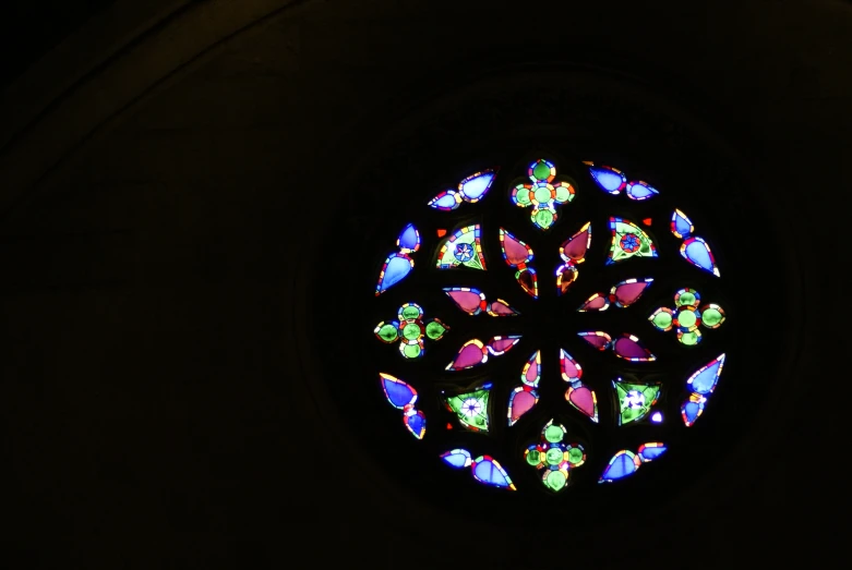 the inside view of a colorful stained glass window