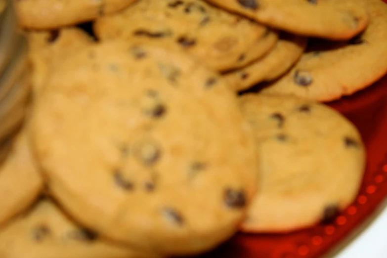 many cookies sitting on a red tray together