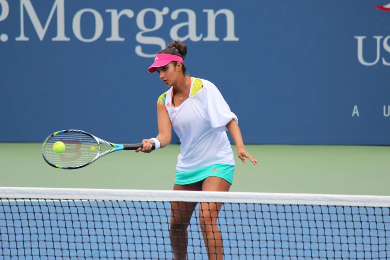 a tennis player is taking a swing at the ball
