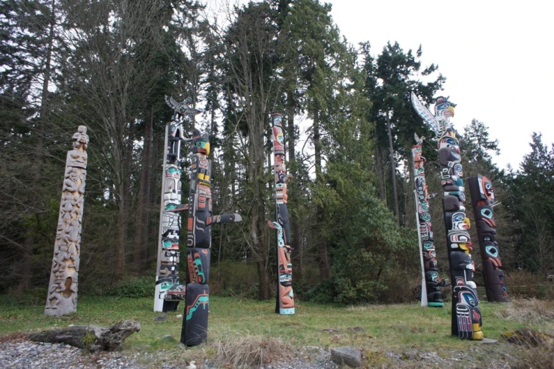 the wooden poles have different designs on them