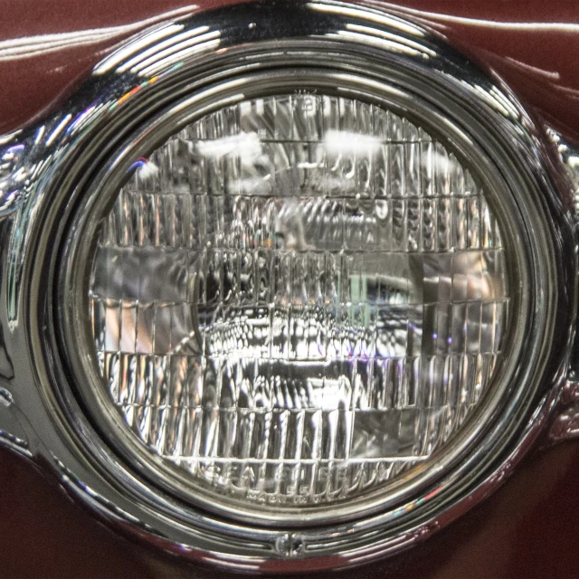 a closeup of the headlight on an old style vehicle