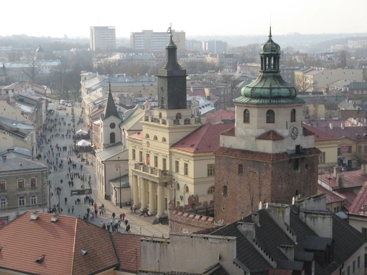 a city with tall buildings and tall steeples with clock towers