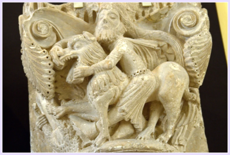 a carved decoration with a man riding a horse