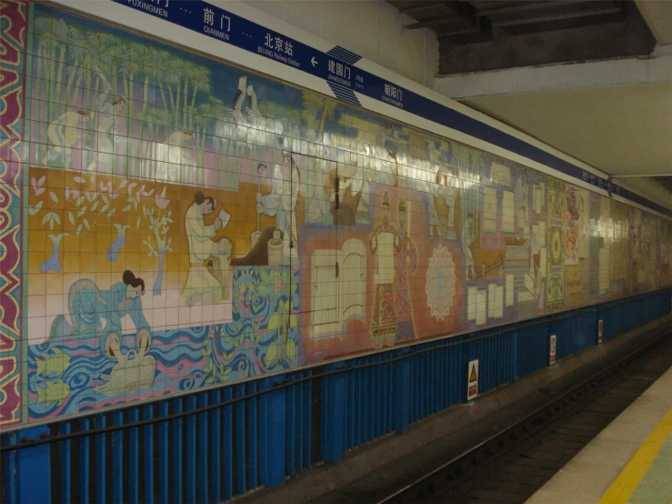 a wall with lots of colorful mosaic tiles