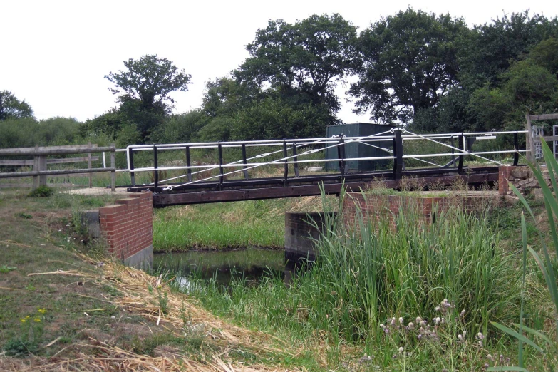 a bridge that has a metal fence over it