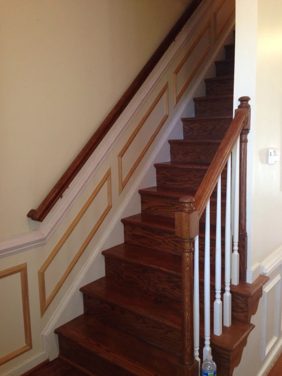 the stairs of a house with a bottle of water in it