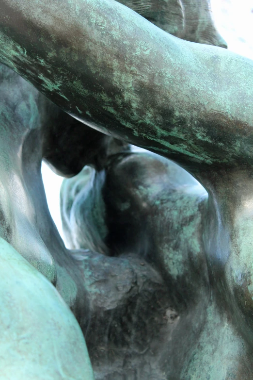 closeup of the back of a statue with one arm in it