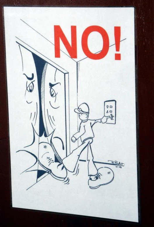 a sign posted on the side of a door telling not to enter