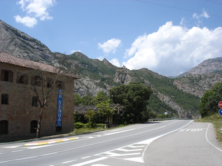 there is a road that has two buildings in it