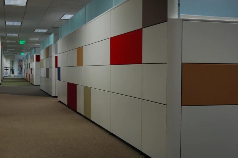 an office with white walls and multiple colors