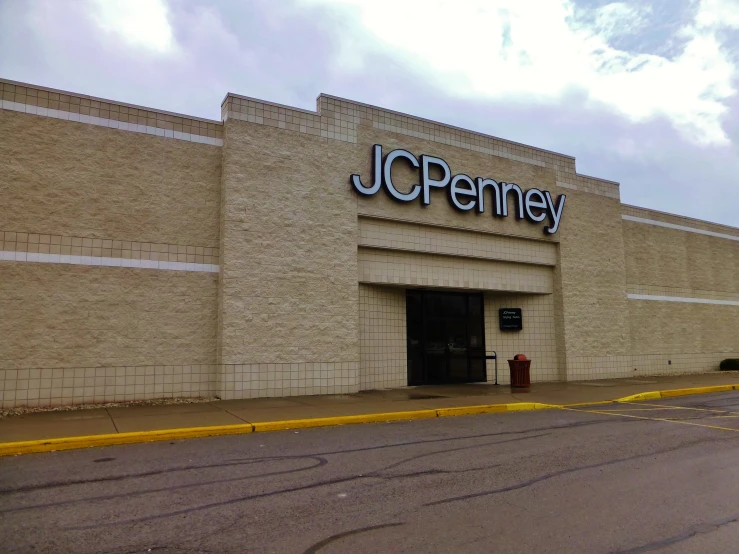 a jcc penney store on the side of a road