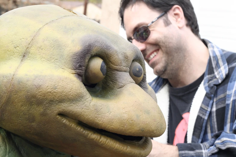 a close up of a person with a statue