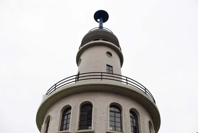 a large brick building with a clock at the top