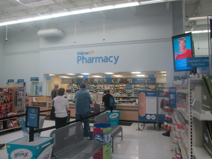 pharmacy with several people and a pharmcy center