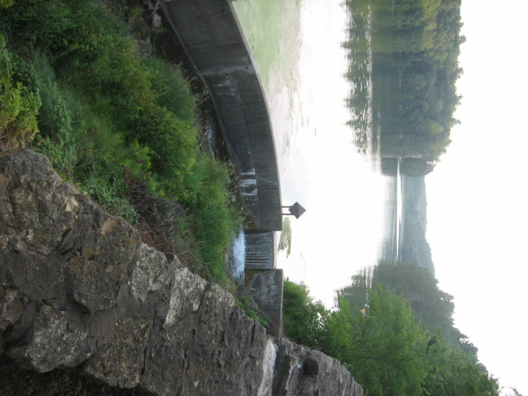 a view looking down at a dam on a river