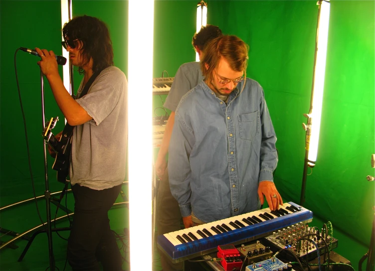 two musicians with a pipe and a keyboard