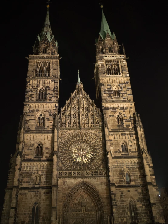 gothic cathedral in europe is illuminated by a street light