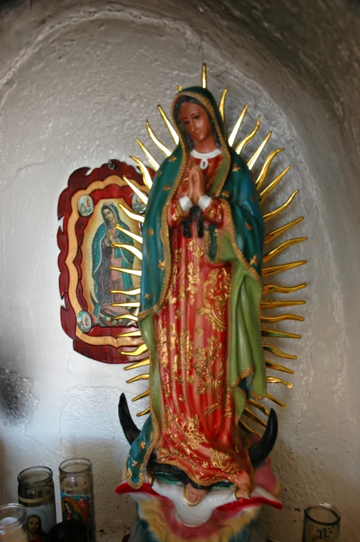 a statue that has the image of our lady of guadalupe