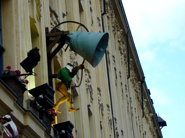 an old bell that is outside a building