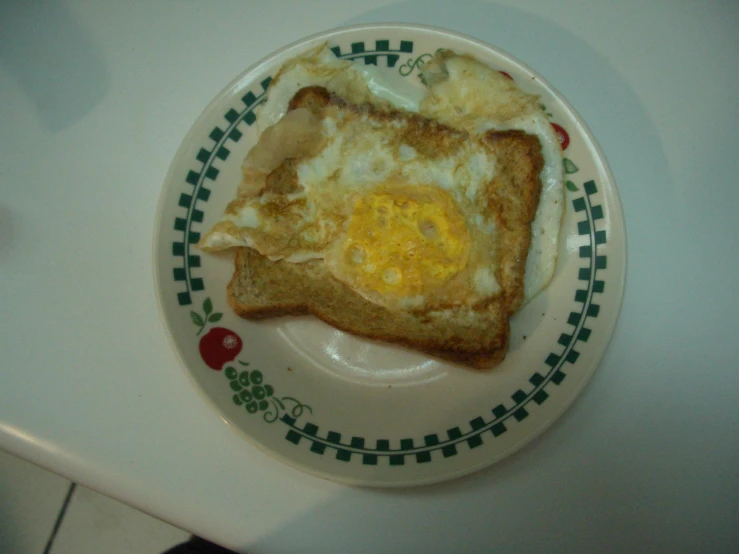 there is an egg in a toast on this plate