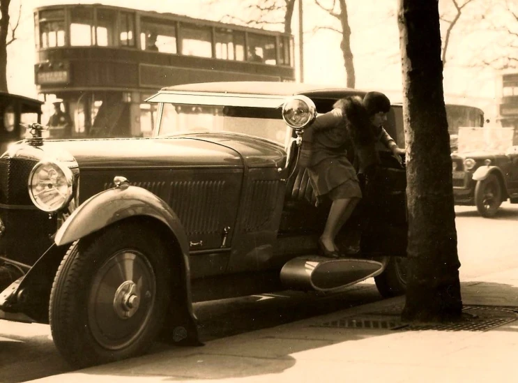 a vintage po shows two girls in the cab of a car