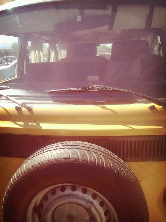 a large yellow bus sitting in a parking lot