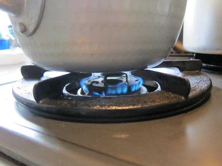 a glass burner in the middle of a stove