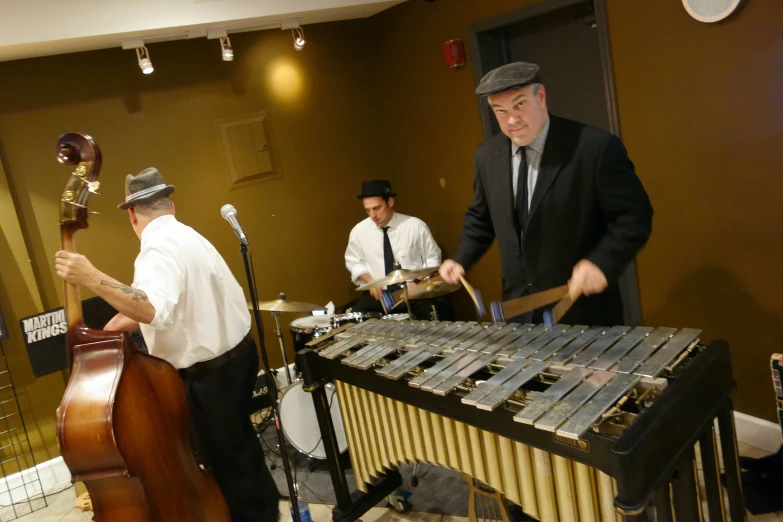 several men are dressed nicely playing music