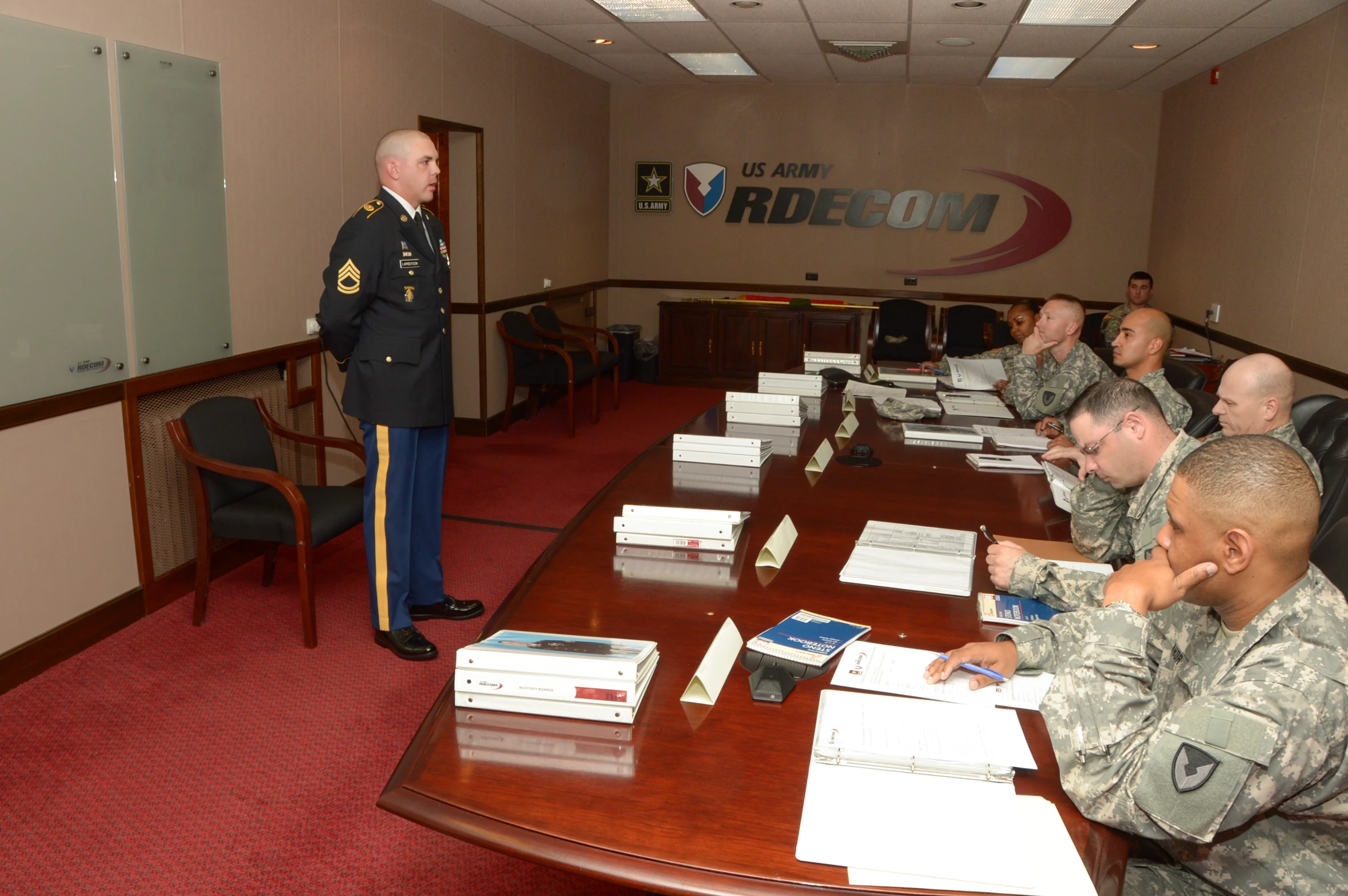 a group of military men sitting at tables