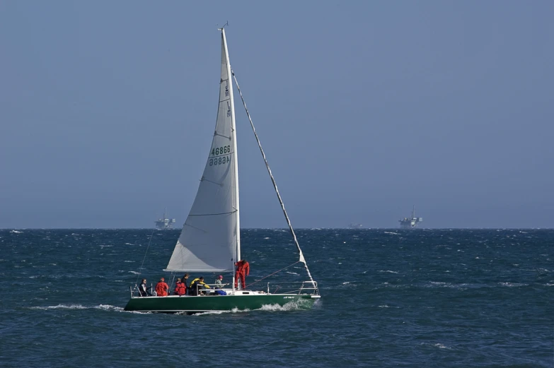 a small sailboat moving on choppy waters