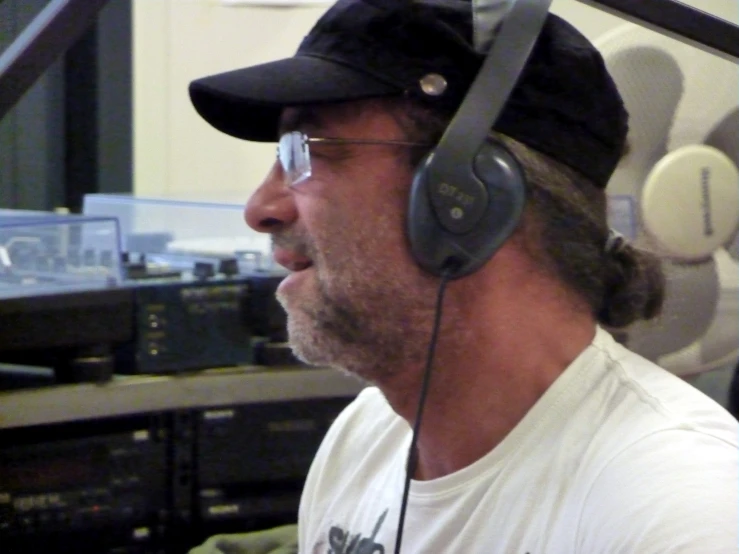 a man in a recording studio with headphones on