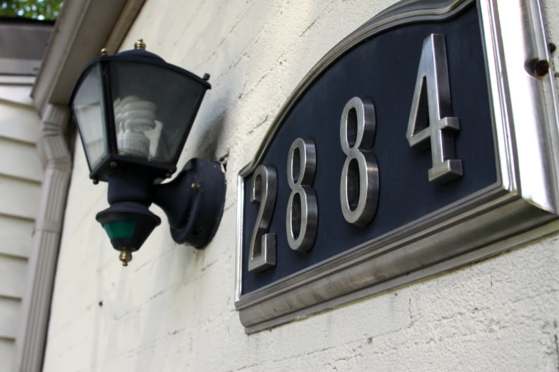 an old fashioned light mounted to the side of a building