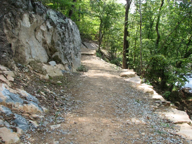 the path to the top of the mountain is made from gravel and rocks